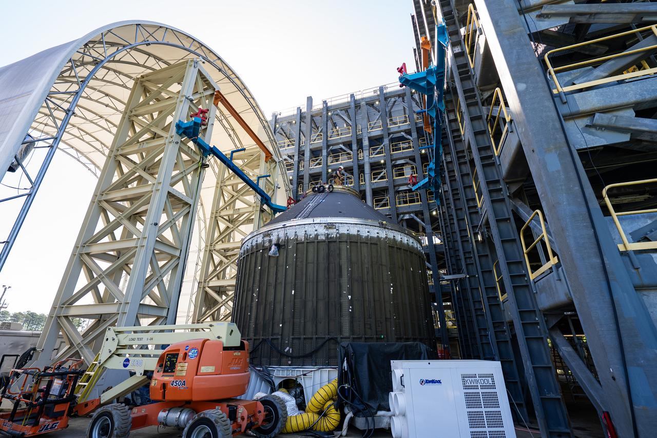 Technicians at NASA’s Marshall Space Flight Center in Huntsville, Alabama, are seen in these images taken April 17, 2025, moving the payload adapter test article from Building 4697 to Building 4705 for storage. This move marks the end of structural testing for the test article. Next, engineers will complete the qualification article and conduct additional for further testing before building the final flight hardware. Manufactured at Marshall, the test article underwent extensive and rigorous testing to validate the design before engineers finalized the configuration for the flight article. The newly completed composite payload adapter is an evolution from the Orion stage adapter to be used in the upgraded Block 1B configuration of the SLS (Space Launch System) rocket, debuting with Artemis IV.